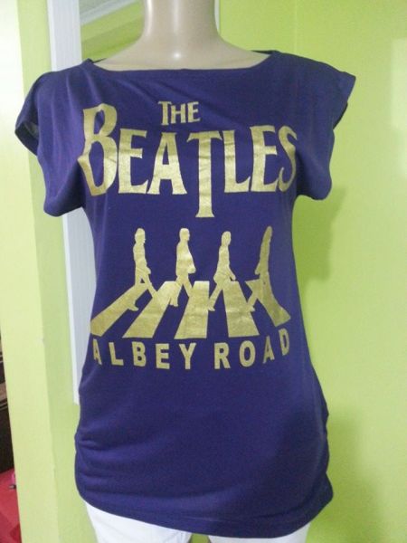 Blusa longa com detalhe de elástico nas laterais